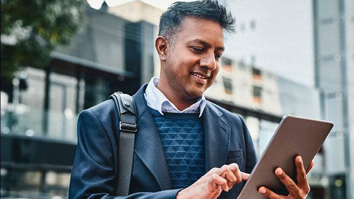 Man looking at his tablet