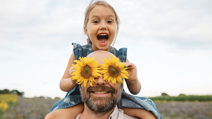 Father and daughter in field