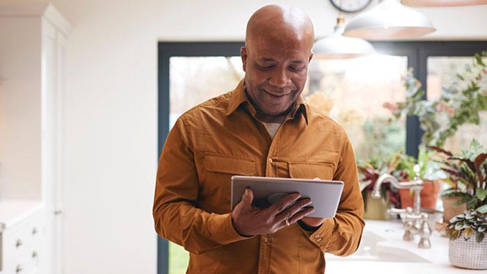 Man looking at his tablet