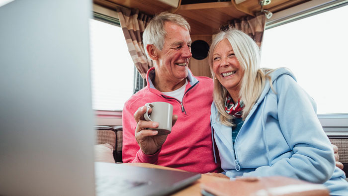 Man and woman at desk with coffee